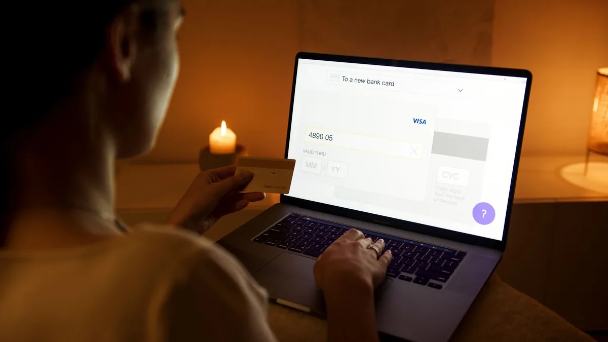 Malaysian ecommerce seller completing FPX online banking payment setup on a laptop