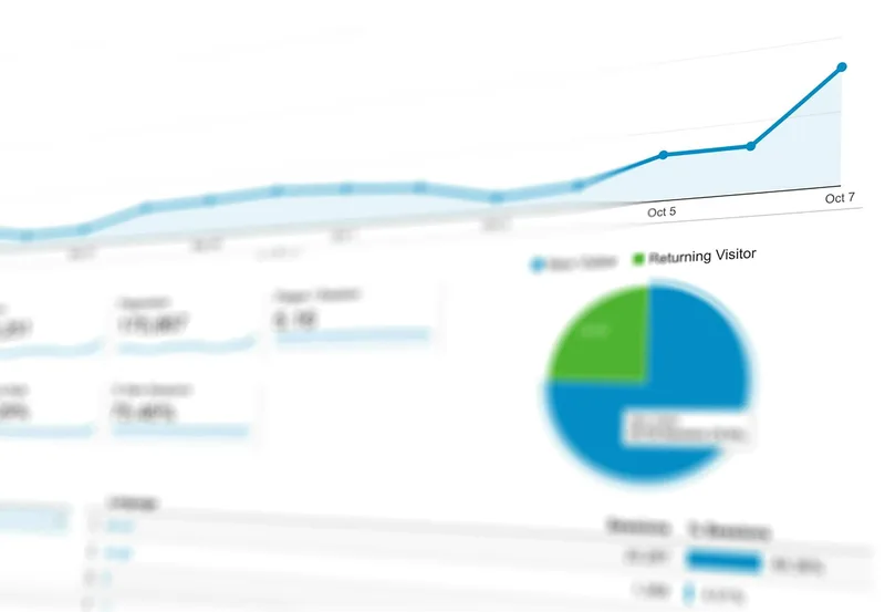 Kredivo merchant dashboard on laptop displaying Indonesian ecommerce transactions with Rp settlement totals, payment status, and BNPL transaction breakdown